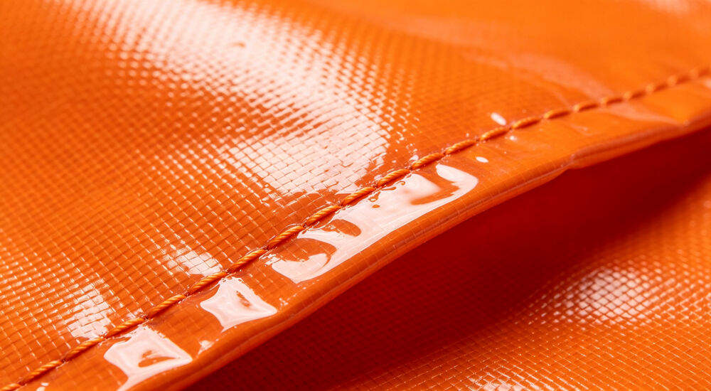 Waterproof coated PVC fabric close up with reinforced stitching for inflatable tent Waterproof coated PVC fabric close up with reinforced stitching for inflatable tent