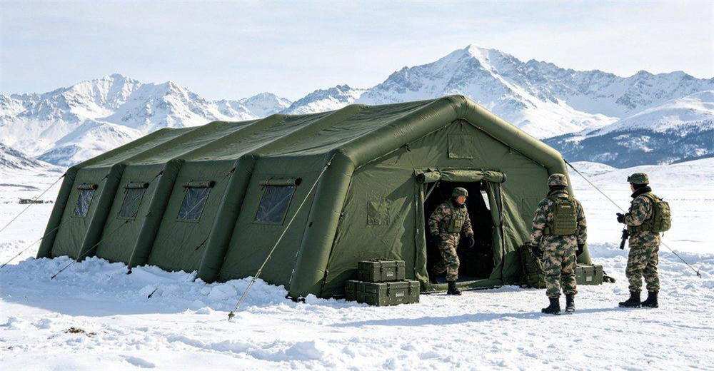 Military inflatable tent in snowy cold environment with snow-covered mountain background, showing tent maintaining structural integrity and providing warm shelter in freezing arctic conditions, demonstrating reliable cold-weather field performance for operations Military inflatable tent in snowy cold environment with snow-covered mountain background, showing tent maintaining structural integrity and providing warm shelter in freezing arctic conditions, demonstrating reliable cold-weather field performance for operations