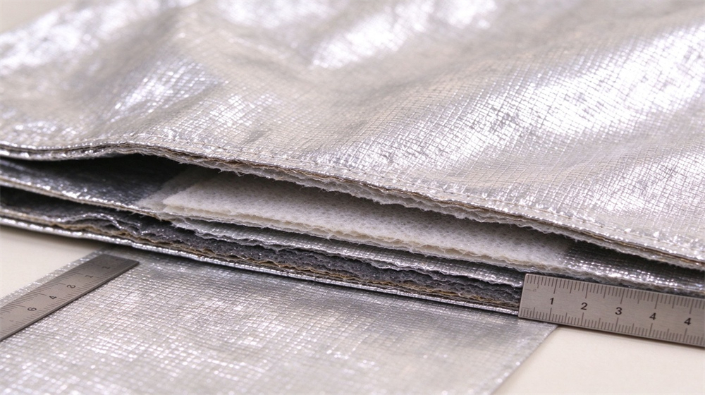 45 degree angle of heavy duty protective firefighter proximity suit, Multilayer aluminized fabric thickness with ruler, proximity suit outer shell insulation lining, demonstrating professional info use in industrial safety environment, designed for wholesale bulk supply and industrial safety procurement. 45 degree angle of heavy duty protective firefighter proximity suit, Multilayer aluminized fabric thickness with ruler, proximity suit outer shell insulation lining, demonstrating professional info use in industrial safety environment, designed for wholesale bulk supply and industrial safety procurement.