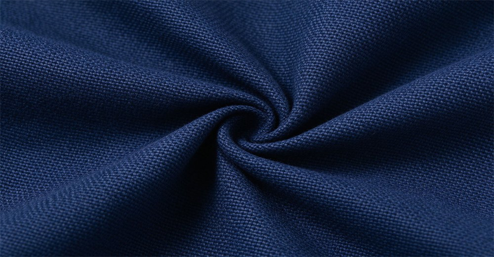 Nomex IIIA aramid outer shell fabric macro texture navy blue flame resistant material weave pattern structural firefighting gear outer layer Nomex IIIA aramid outer shell fabric macro texture navy blue flame resistant material weave pattern structural firefighting gear outer layer